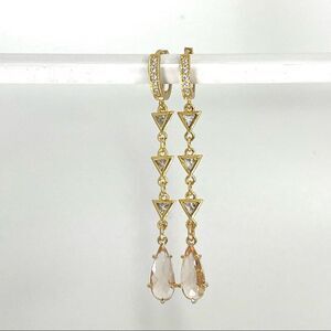 Gold huggie hoops with champagne crystals hung on cubic chain for women